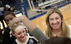 Vicki Seliger-Swenson, right, is stepping down after 25 years as Hopkins volleyball coach.
