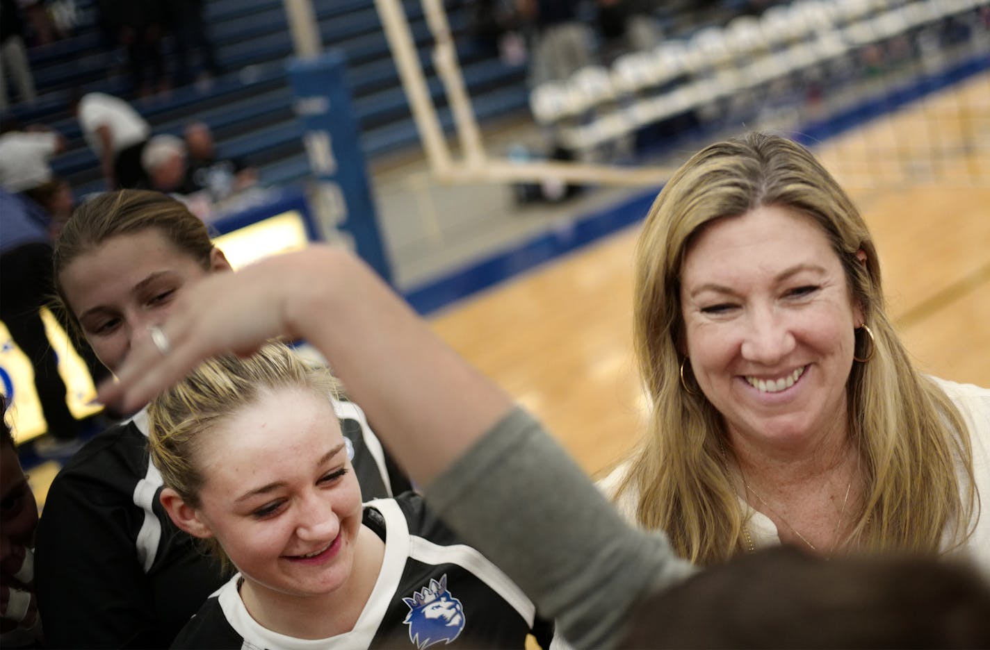 Vicki Seliger-Swenson, right, is stepping down after 25 years as Hopkins volleyball coach.