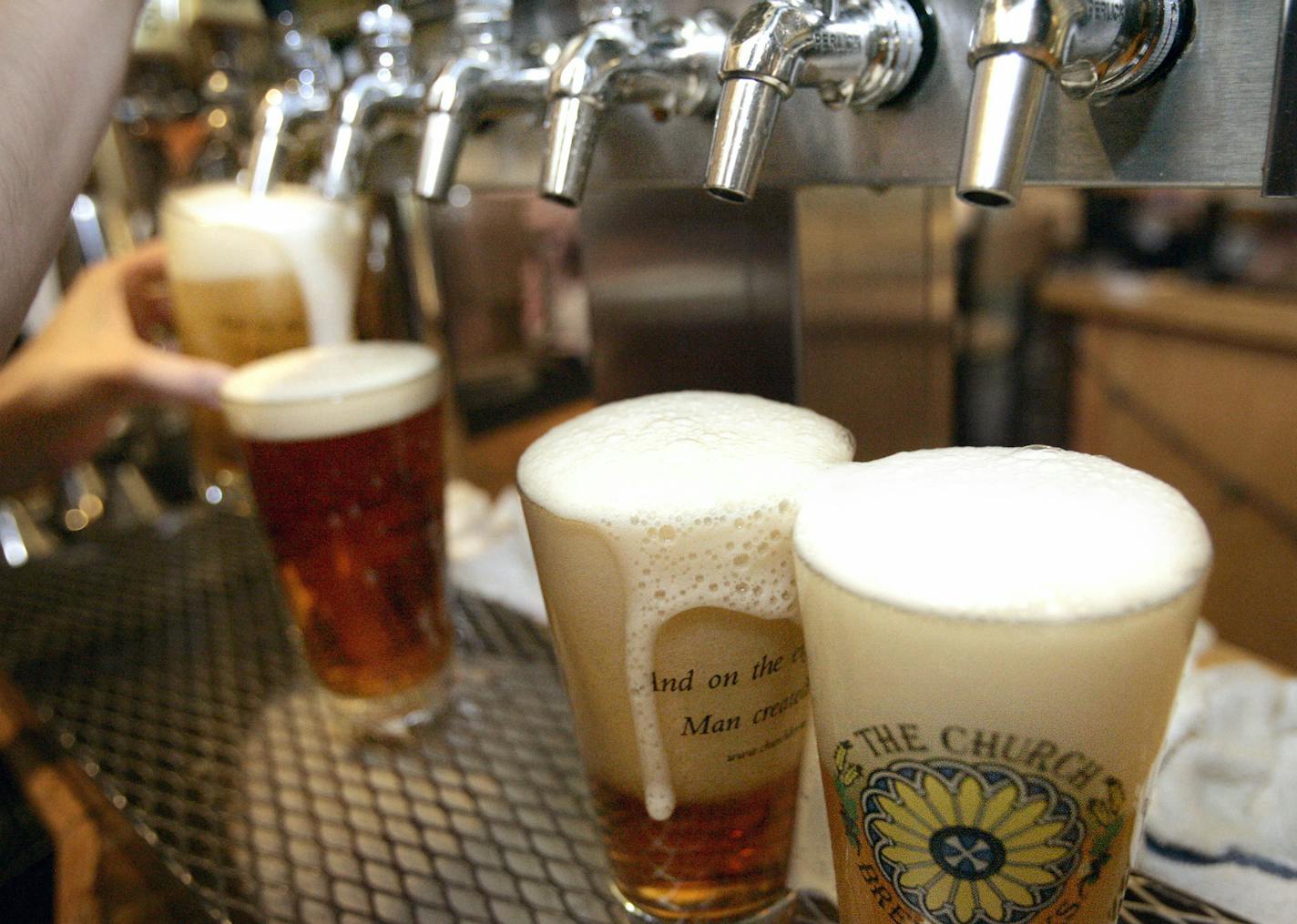 FILE - In this June 6, 2008 file photo, a row of freshly poured draft beers are seen in Pittsburgh. Don&#xed;t want to be confronted with the number of calories in that margarita or craft beer? Avoid the menu and order at the bar. New menu labeling rules from the Food and Drug Administration will require chain restaurants with 20 or more outlets to list the amount of calories in alcoholic drinks, along with other foods, on menus by next November. The idea is that people often don't know _ or eve