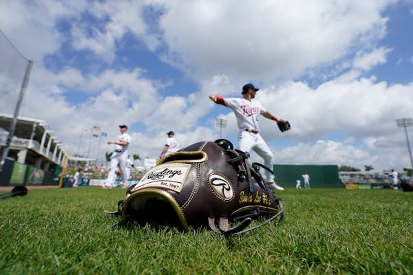 A glove sat on the field as the Twins warmed up before a game against the Yankees last March in Fort Myers, Fla.
