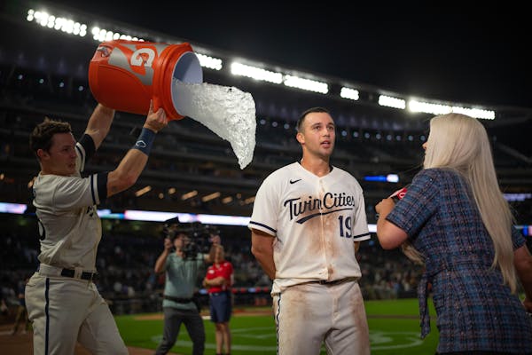 Alex Kirilloff of the Twins was doused with ice water after his game-winning hit against the Padres on May 10, 2023, at Target Field.