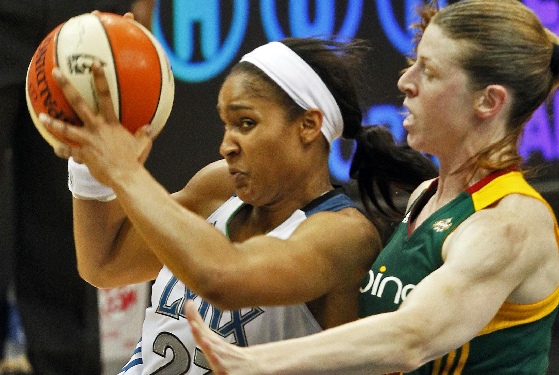 Minnesota Lynx vs. Seattle Storm, Saturday July 16, 2011. Lynx Maya Moore drove to the basket against the defense of Storm Katie Smith.