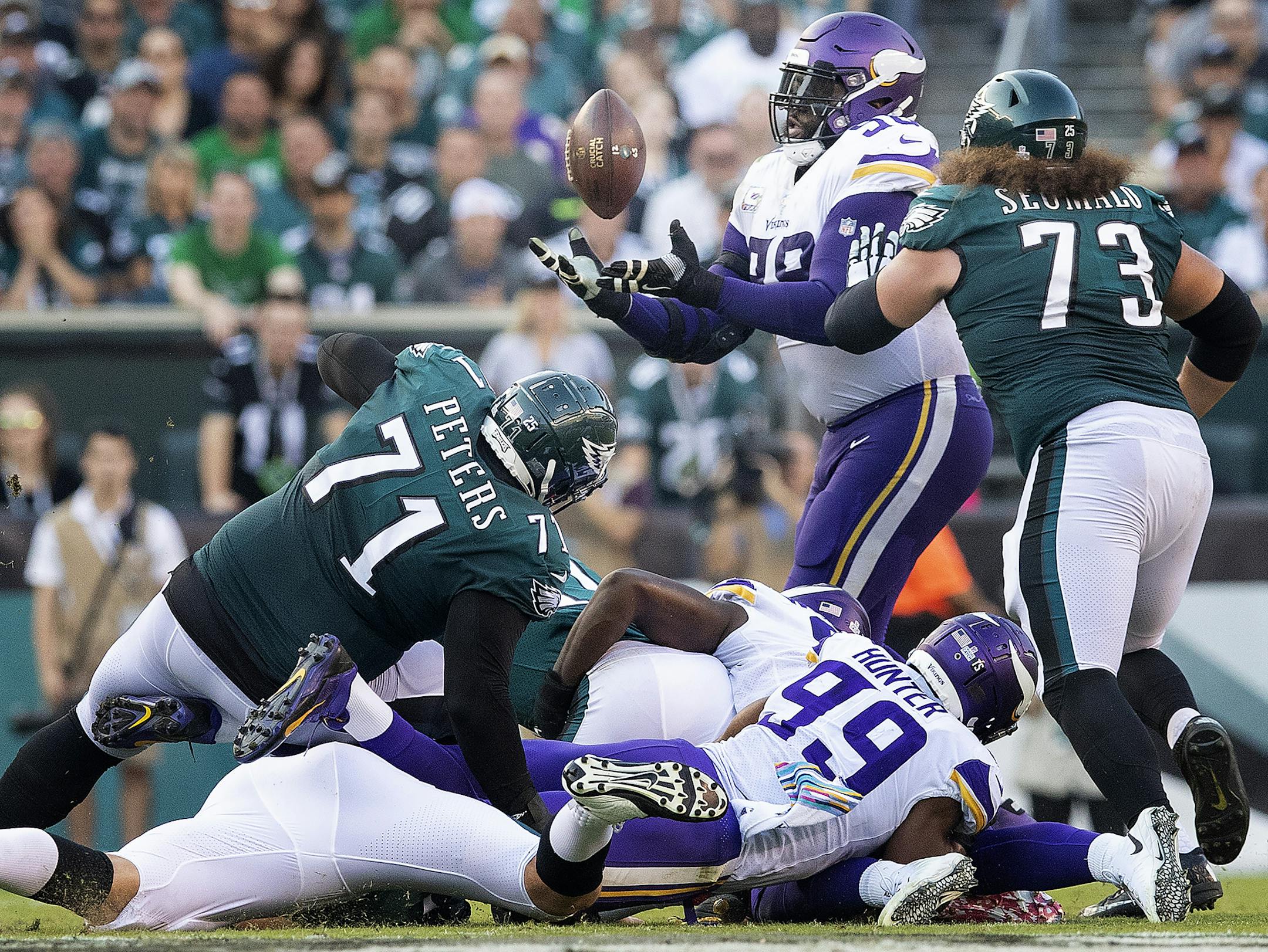 Stephen Weatherly caused Carson Wentz (on ground) to fumble and Linval Joseph grabbed the ball in the air and rumbled 64 yards for a touchdown in the second quarter.