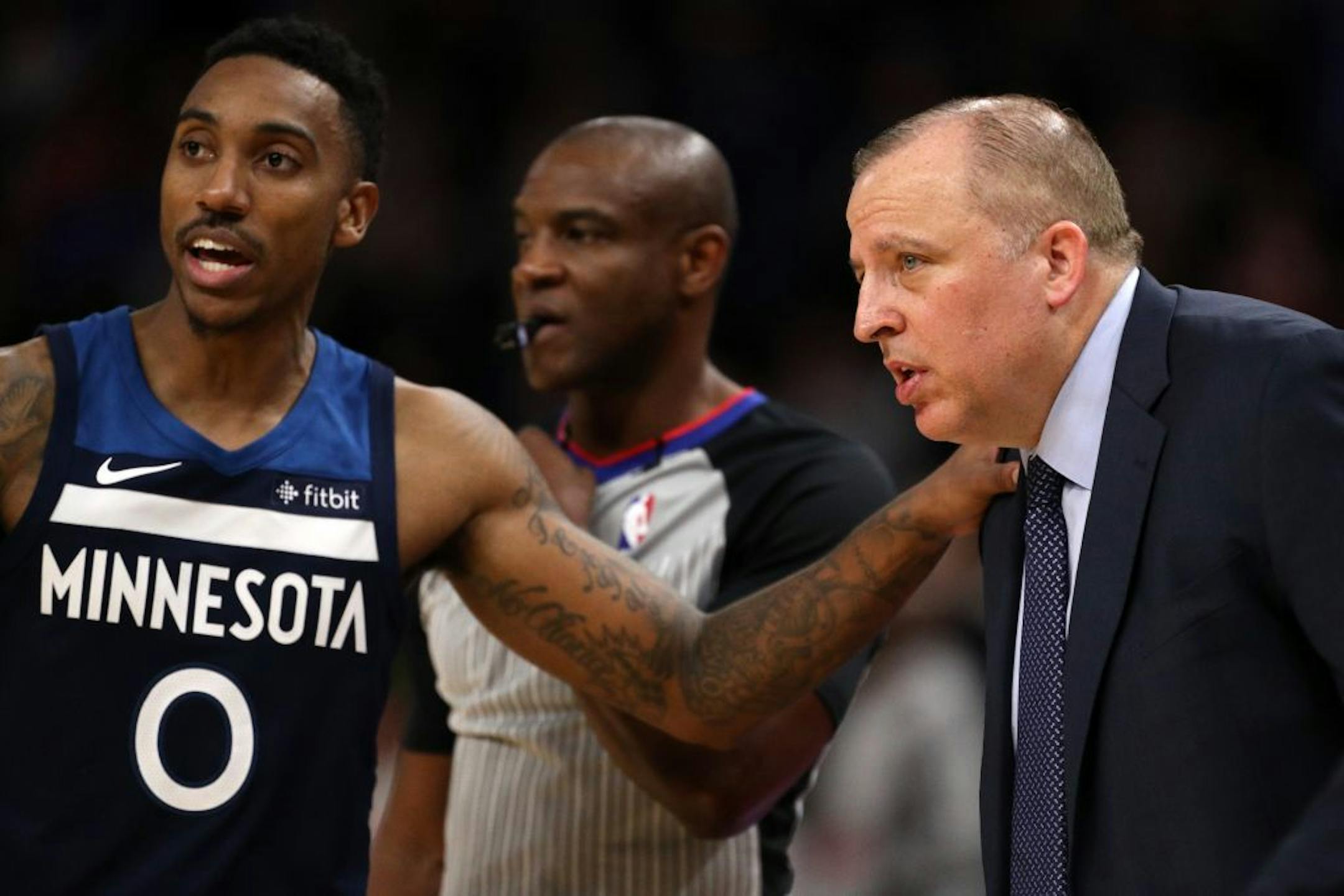 Minnesota Timberwolves guard Jeff Teague (0) talked with Minnesota Timberwolves head coach Tom Thibodeau.