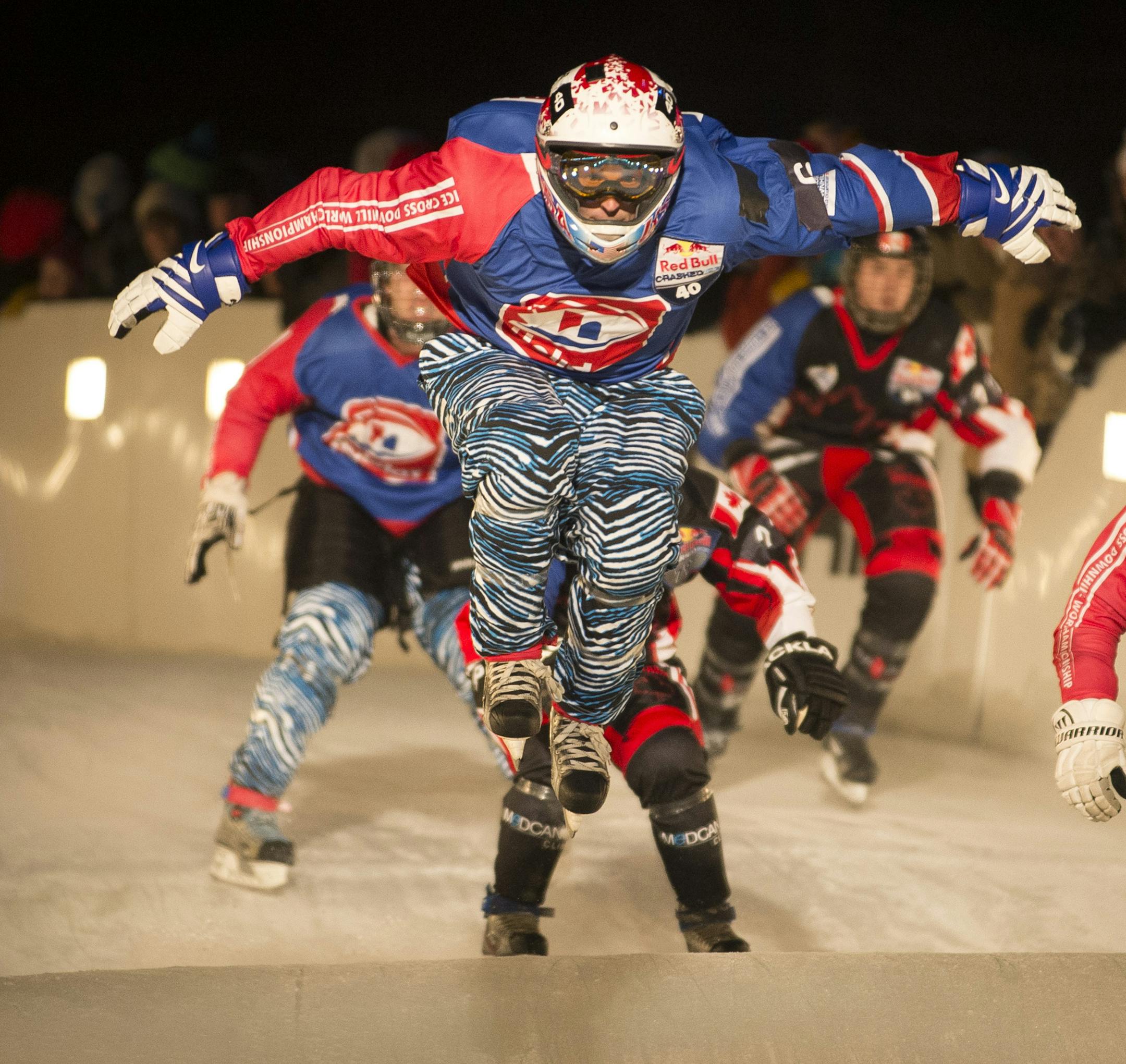 Daniel Bergeson left, with Team Murica , catches some air while racing against Team Quebec in the semifinals of the Crashed Ice team competition on Friday night. ] (Aaron Lavinsky | StarTribune) The team competition qualifiers and finals of Red Bull's Crashed Ice National Shootout take place at the St. Paul Cathedral on Friday, Jan. 23, 2015.