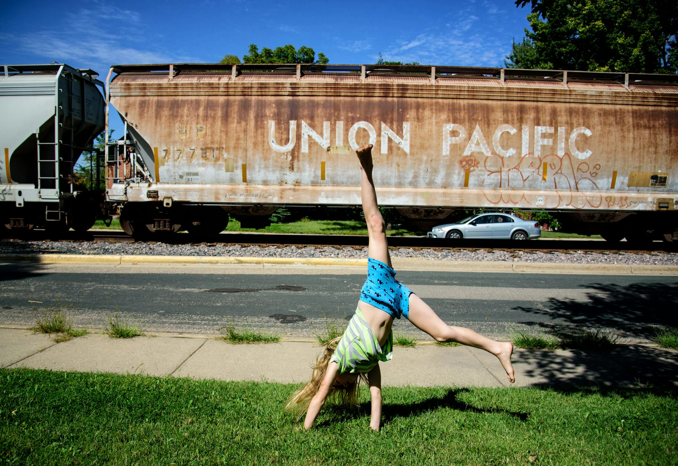 Priscilla Applegate, 7 did cartwheels as a Union Pacific train blew its horn past her Shakopee home as it does around the clock here along 2nd Ave E. ] GLEN STUBBE * gstubbe@startribune.com Monday September 7, 2015 The Shakopee City Council is exploring creating a one to two mile "quiet zone" downtown, where a train comes through and sounds its horns at every intersection, four to six times a day. A small but vocal group of residents and businesses are complaining about the noise, but the change