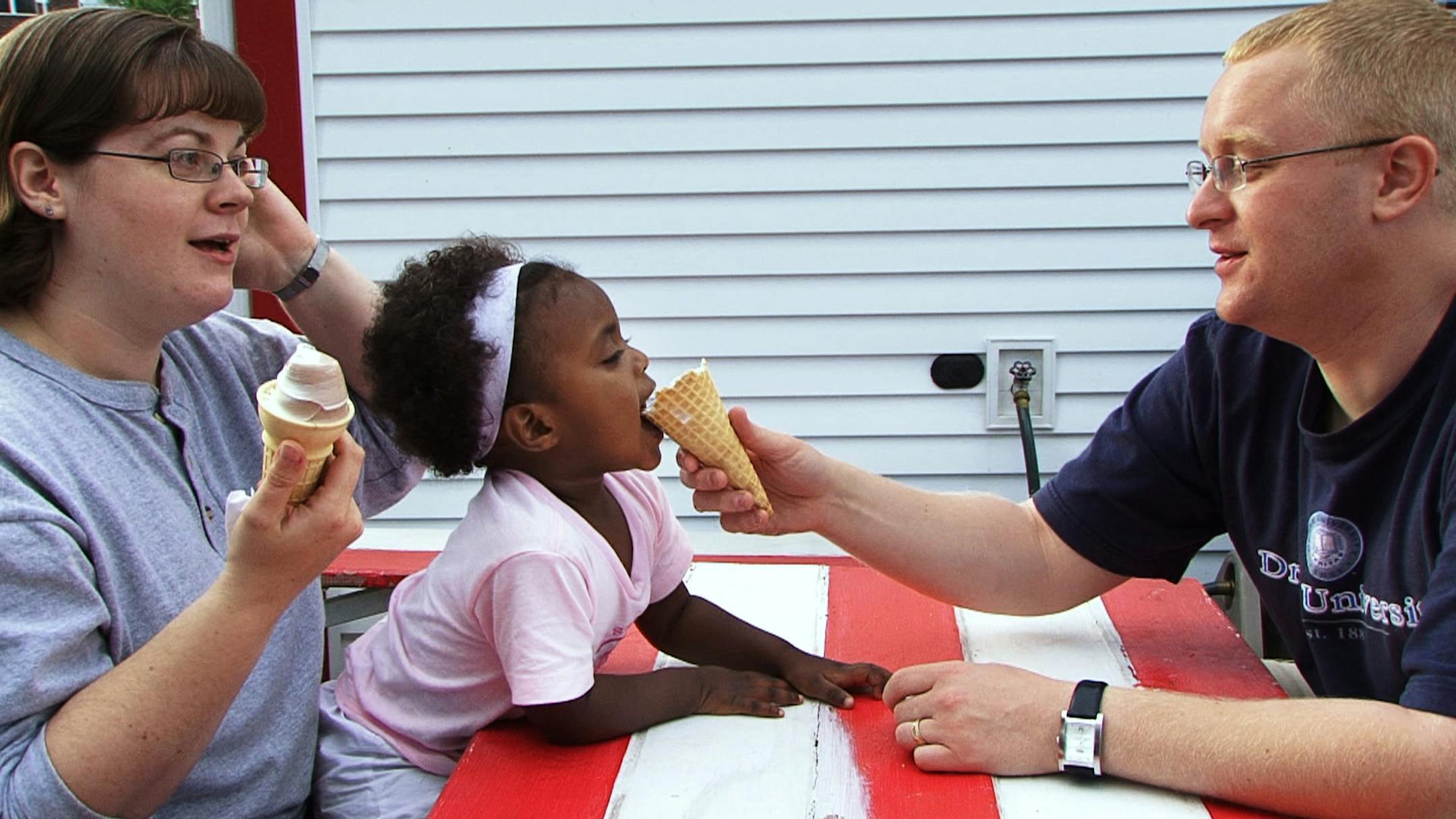 At Conny's Creamy Cone, from the left, Amy Myron, daughter Ella, and husband Andrew enjoyed a couple of ice cream cones after picking up some office supplies on University Avenue in St. Paul. The Cone, as it is known, stays open as long as there are customers seeking a cool treat.