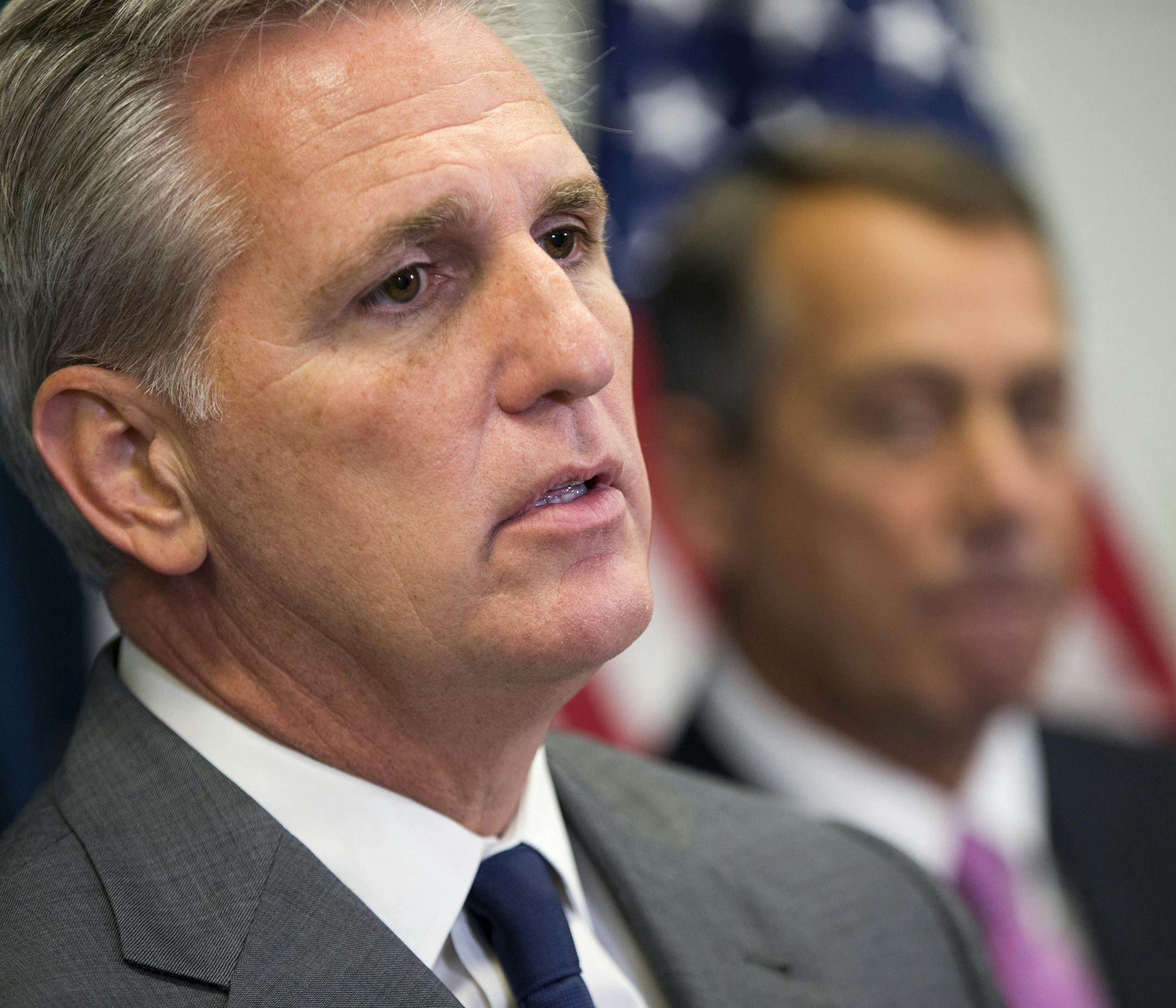 House Majority Leader Kevin McCarthy of Calif., left, accompanied by outgoing House Speaker John Boehner of Ohio, speaks during a new conference on Capitol Hill in Washington, Wednesday, Oct. 7, 2015, following the weekly House Republican conference. The House’s most hard-edged conservatives are trying to keep McCarthy from inheriting the Speaker post from Boehner once he steps down. (AP Photo/Evan Vucci)