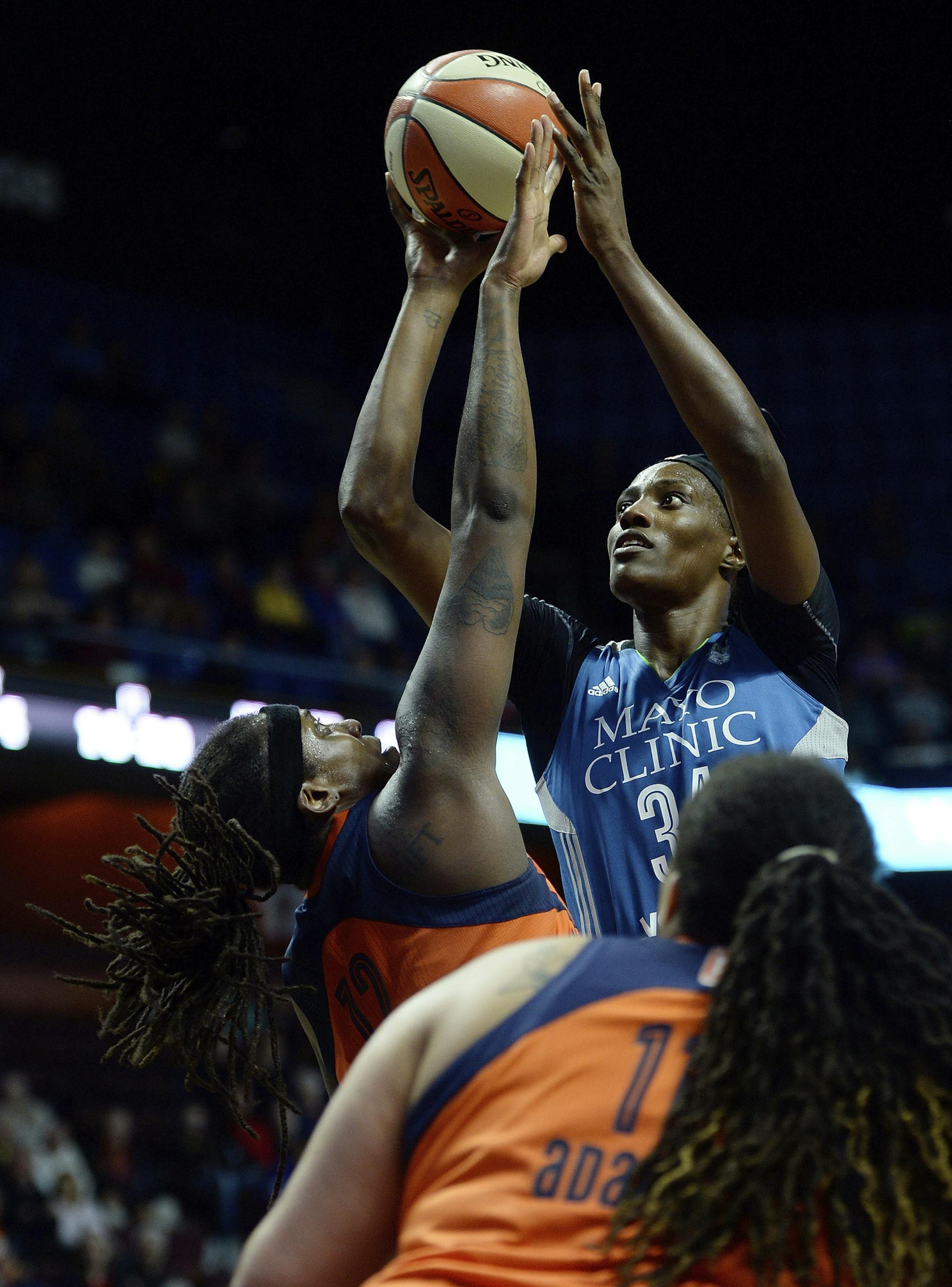 Minnesota Lynx's Sylvia Fowles is fouled by Connecticut Sun's Lynetta Kizer in the second half of a WNBA basketball game Friday, May 26, 2017, in Uncasville, Conn.. (Sean D. Elliot/The Day via AP)