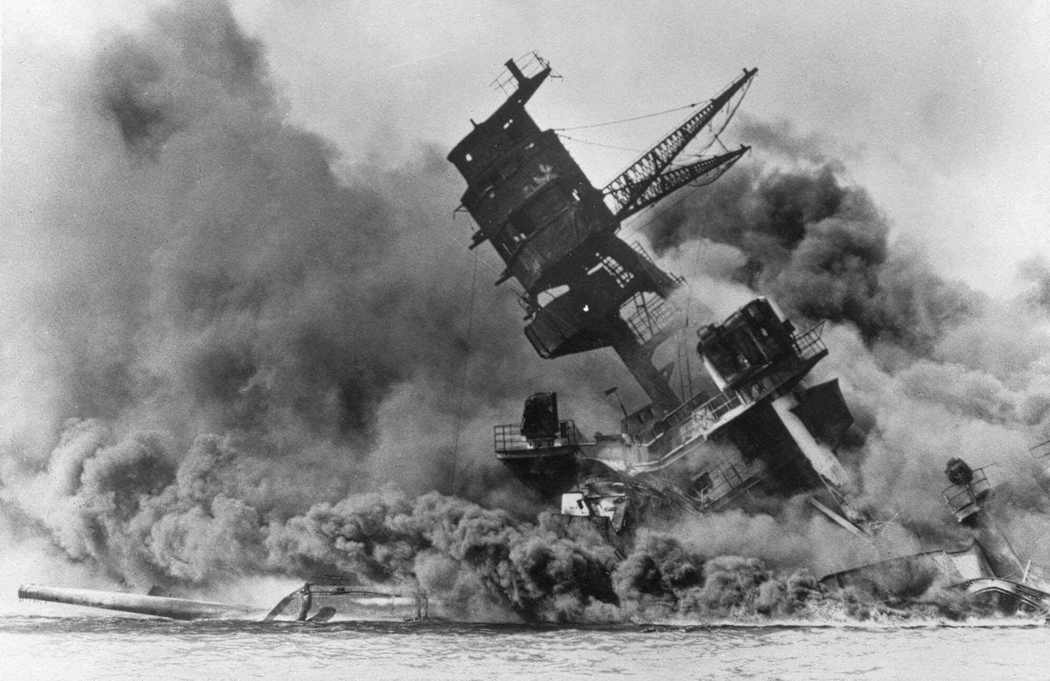 Smoke rises from the battleship USS Arizona as it sinks during a Japanese surprise attack on Pearl Harbor, Hawaii, on Dec. 7, 1941.