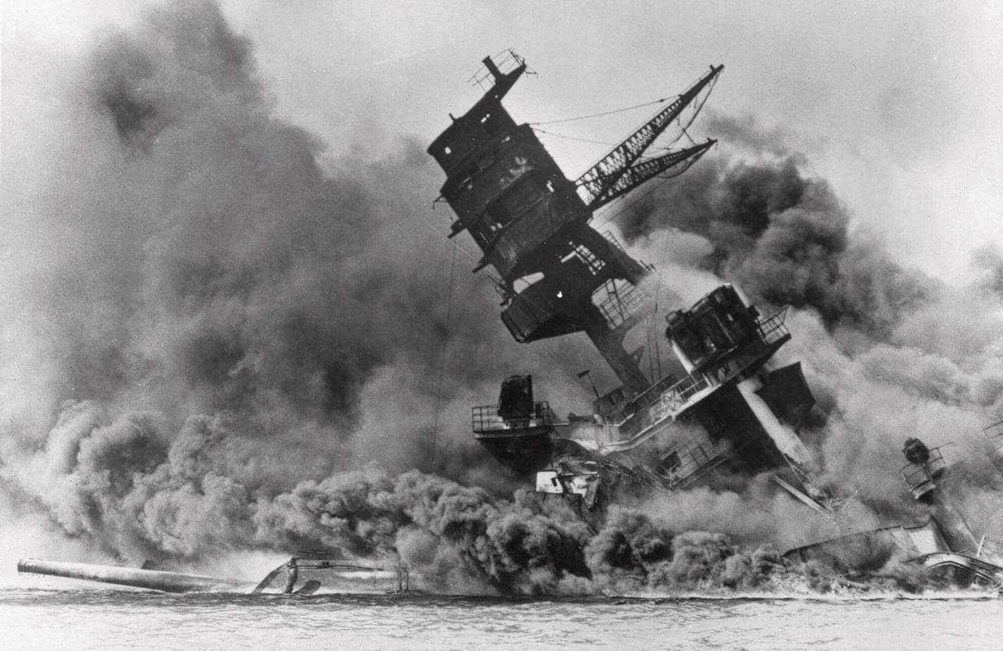 Smoke rises from the battleship USS Arizona as it sinks during a Japanese surprise attack on Pearl Harbor, Hawaii, on Dec. 7, 1941.