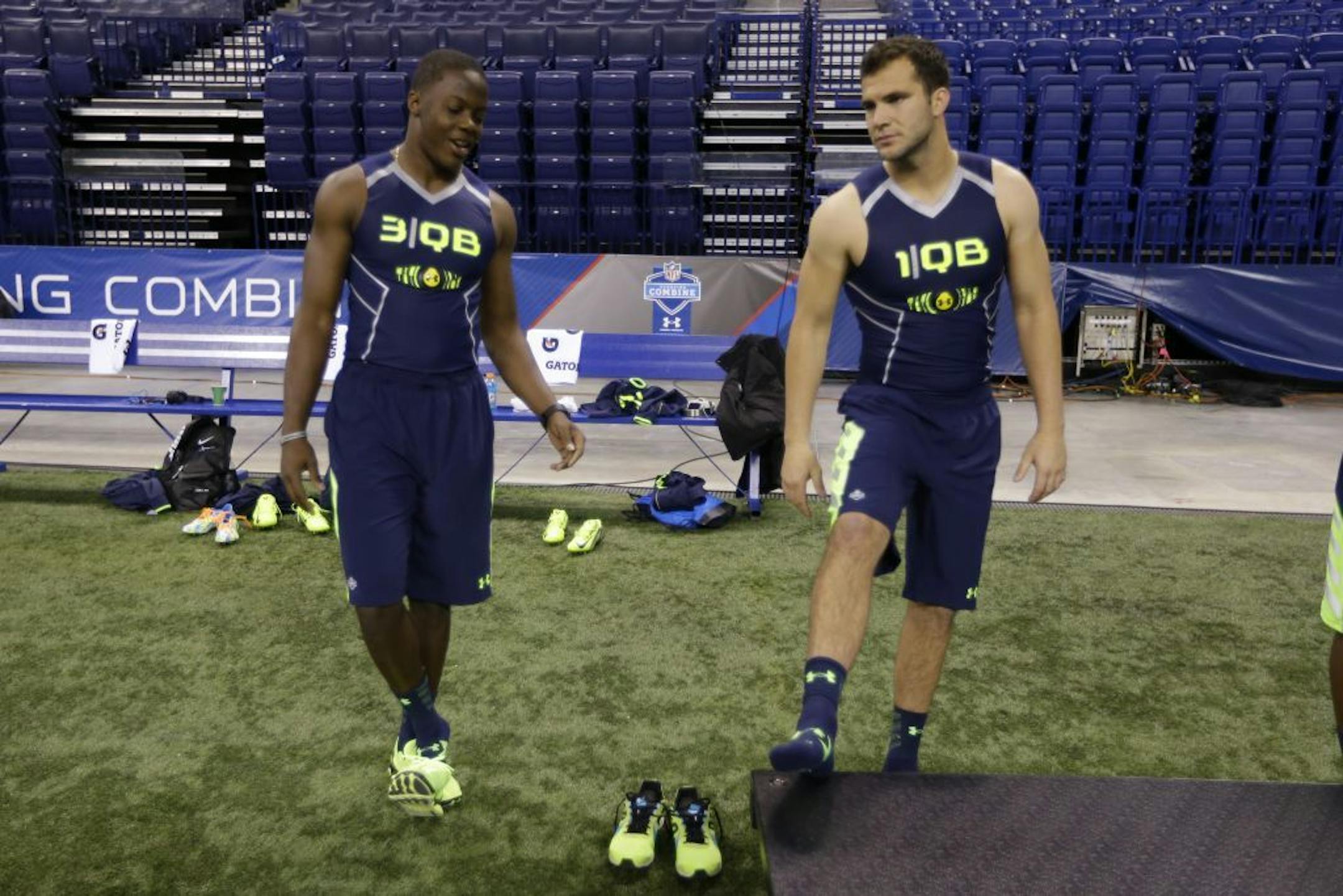 Louisville quarterback Teddy Bridgewater, right, talks with Central Florida quarterback Blake Bortles at the NFL football scouting combine in Indianapolis, Sunday, Feb. 23, 2014.