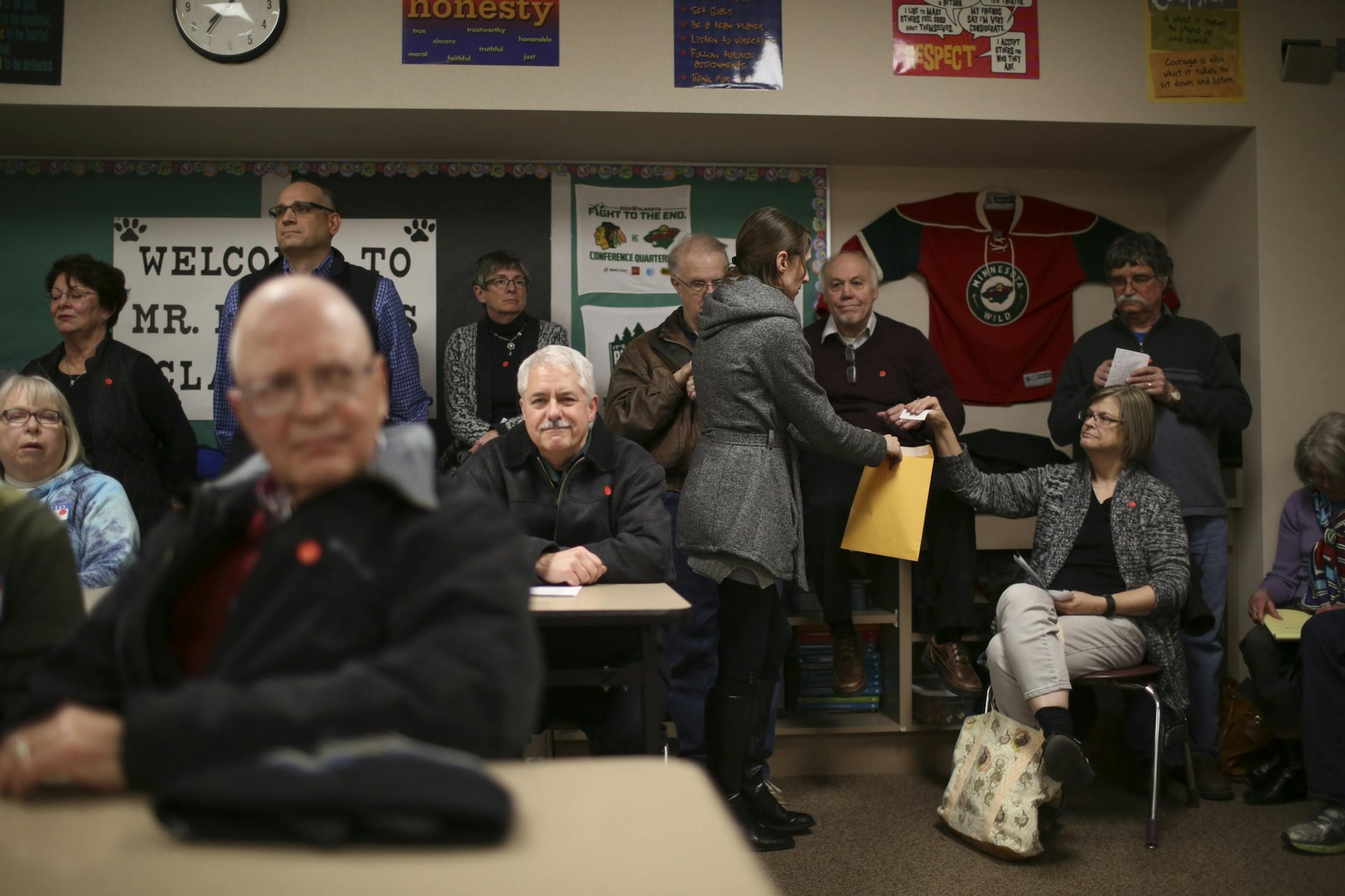 Janeen Raaen collected ballots from voters who attended the Burnsville precinct 9 Republican caucus Tuesday night at Black Hawk Middle School. Sen. Marco Rubio won the contest with 40 votes, followed by Sen. Ted Cruz with 19, Donald Trump 17, Ben Carson 7, and John Kasich 3.