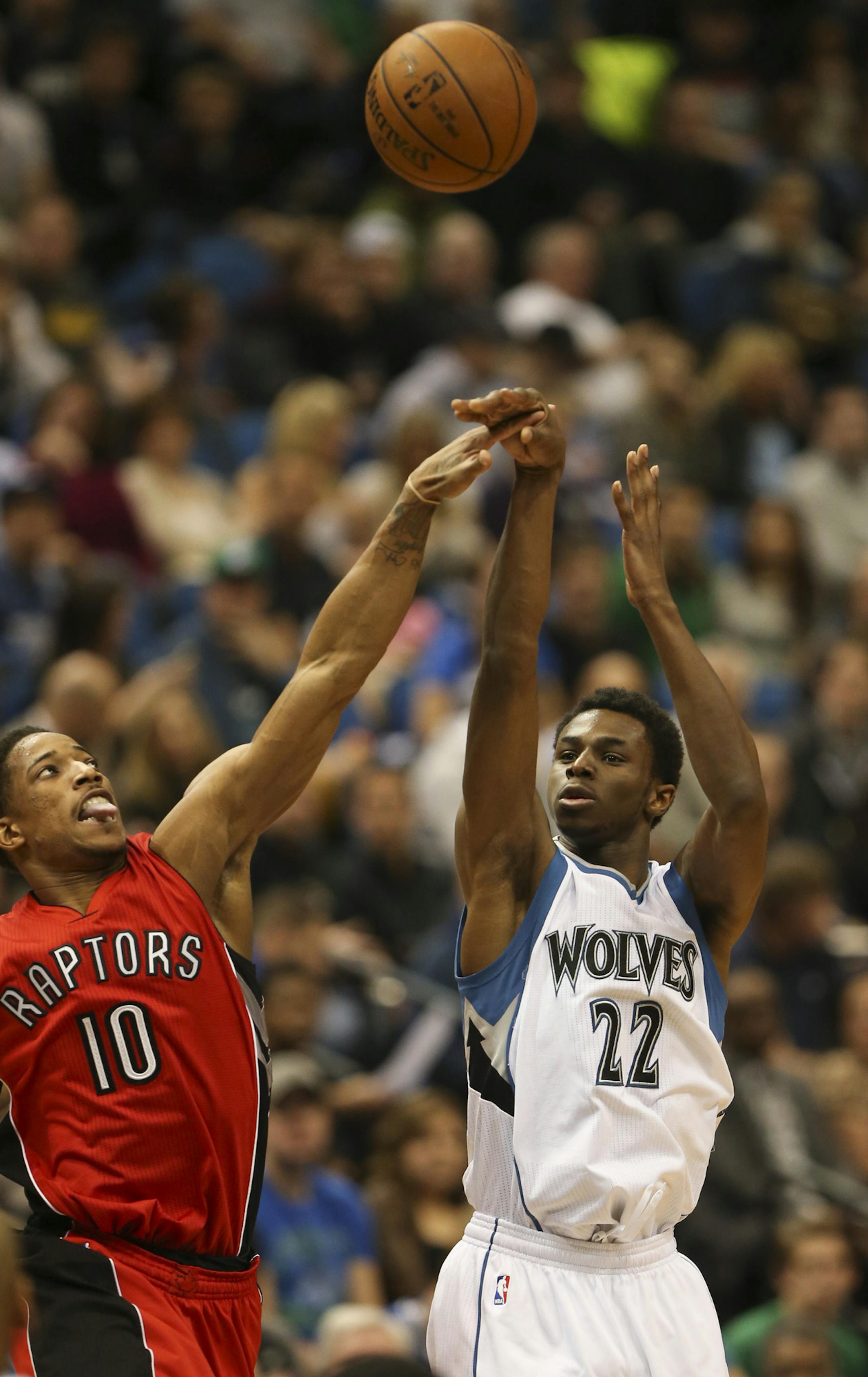 Timberwolves forward Andrew Wiggins took a third quarter shot over Raptors guard DeMar DeRozan in the third quarter Wednesday night at Target Center. Wiggins led the Twolves with 25 points. ] JEFF WHEELER ï jeff.wheeler@startribune.com The Minnesota Timberwolves lost 113-99 to the Toronto Raptors in an NBA game Wednesday night, April 1, 2015 at Target Center in Minneapolis.