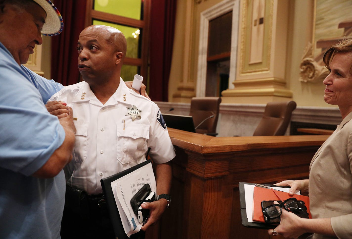 Acting police chief Medaria &#xec;Rondo&#xee; Arradondo got a hug from local activist Clyde Bellecourt as Mayor Betsy Hodges looked on following the public hearing. ] ANTHONY SOUFFLE &#xef; anthony.souffle@startribune.com The Minneapolis City Council&#xed;s Public Safety, Civil Rights and Emergency Management Committee held a public hearing on the nomination of Medaria &#xec;Rondo&#xee; Arradondo to be the City&#xed;s next police chief Wednesday, Aug. 9, 2017 at City Hall.