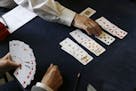 FILE - In this Tuesday, Sept. 22, 2015 file photo, competitors play bridge at the Acol Bridge Club in West Hampstead, London. A doping ban handed down