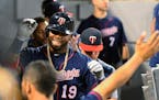 Minnesota Twins' Kennys Vargas (19) celebrates ninth dugout after his home run against the Chicago White Sox during the fifth inning of a baseball gam