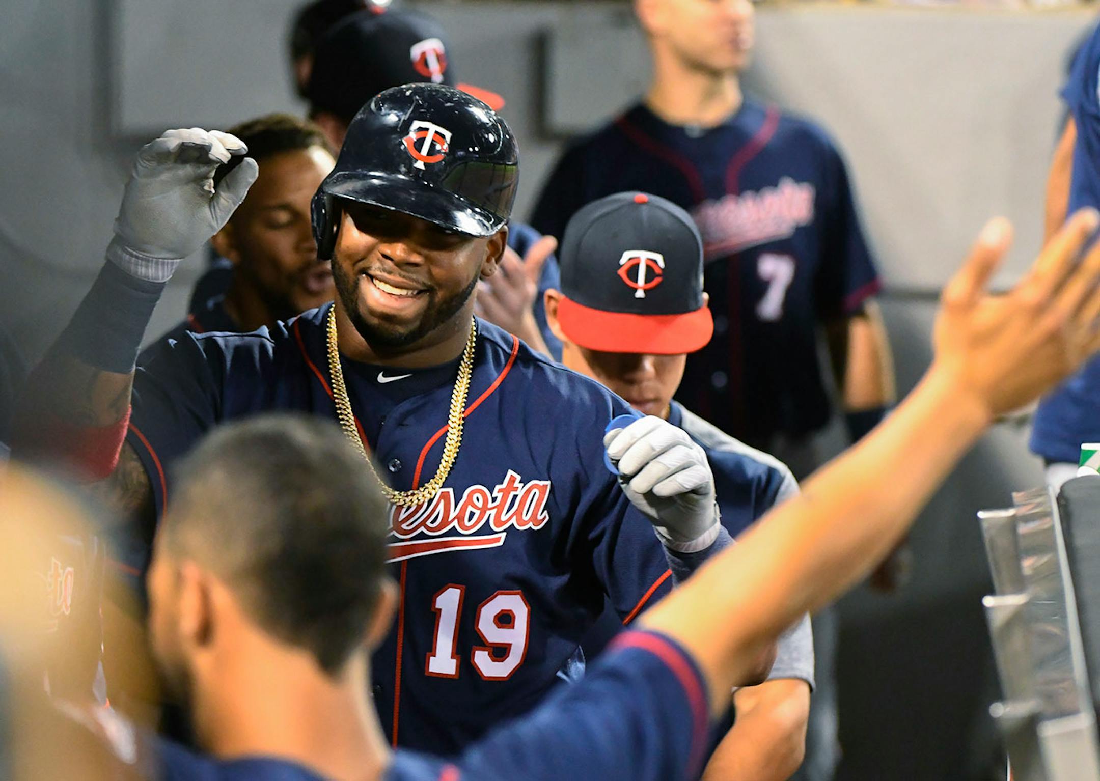 Minnesota Twins' Kennys Vargas (19) celebrates ninth dugout after his home run against the Chicago White Sox during the fifth inning of a baseball game in Chicago on Tuesday, Aug. 22, 2017.