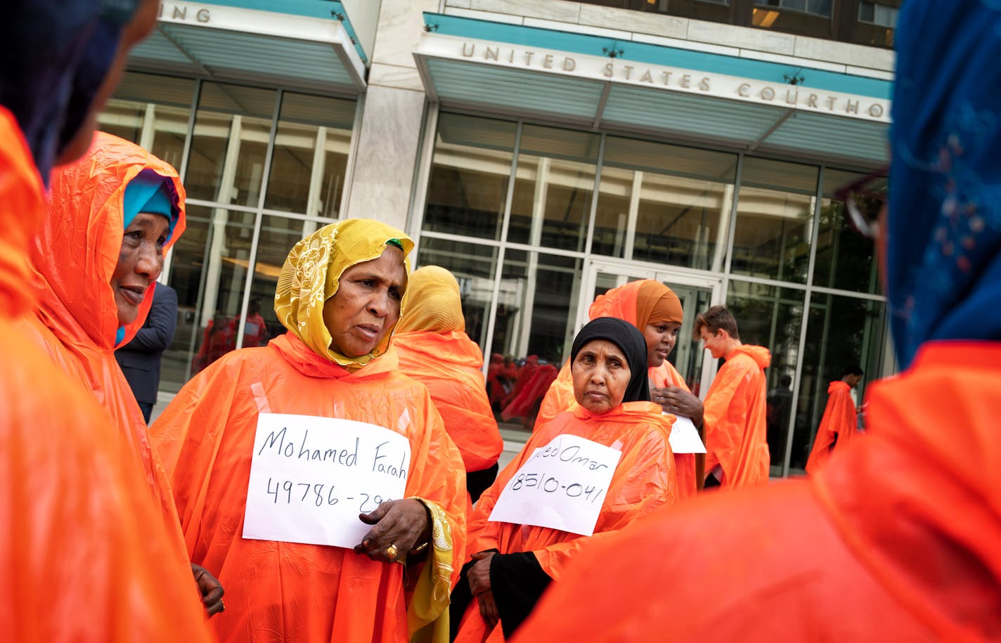 Protesters wore orange ponchos in solidarity with the three men being who were convicted in plotting to join ISIS. The men are appearing before a three-judge federal appeals court panel Thursday morning. Protesters were not allowed to enter the courthouse until the orange ponchos and signs bearing the names of the convicted men were removed. ] GLEN STUBBE &#xef; glen.stubbe@startribune.com Thursday, June 14, 2018 Attorneys for three men convicted of plotting to join ISIS will make oral arguments