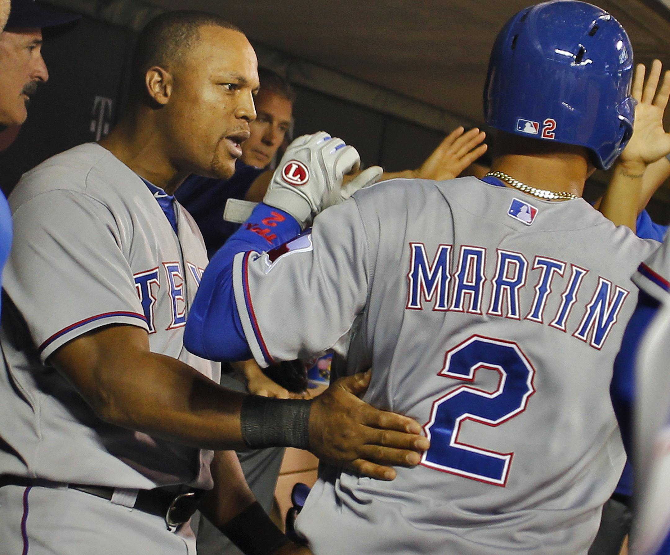 Texas Leonys Martin was congratulated in the dugoout after he scored the only run in the game in 7th inning action. ] Minnesota Twins vs. Texas Rangers. . Texas won 1-0. (MARLIN LEVISON/STARTRIBUNE(mlevison@startribune.com)