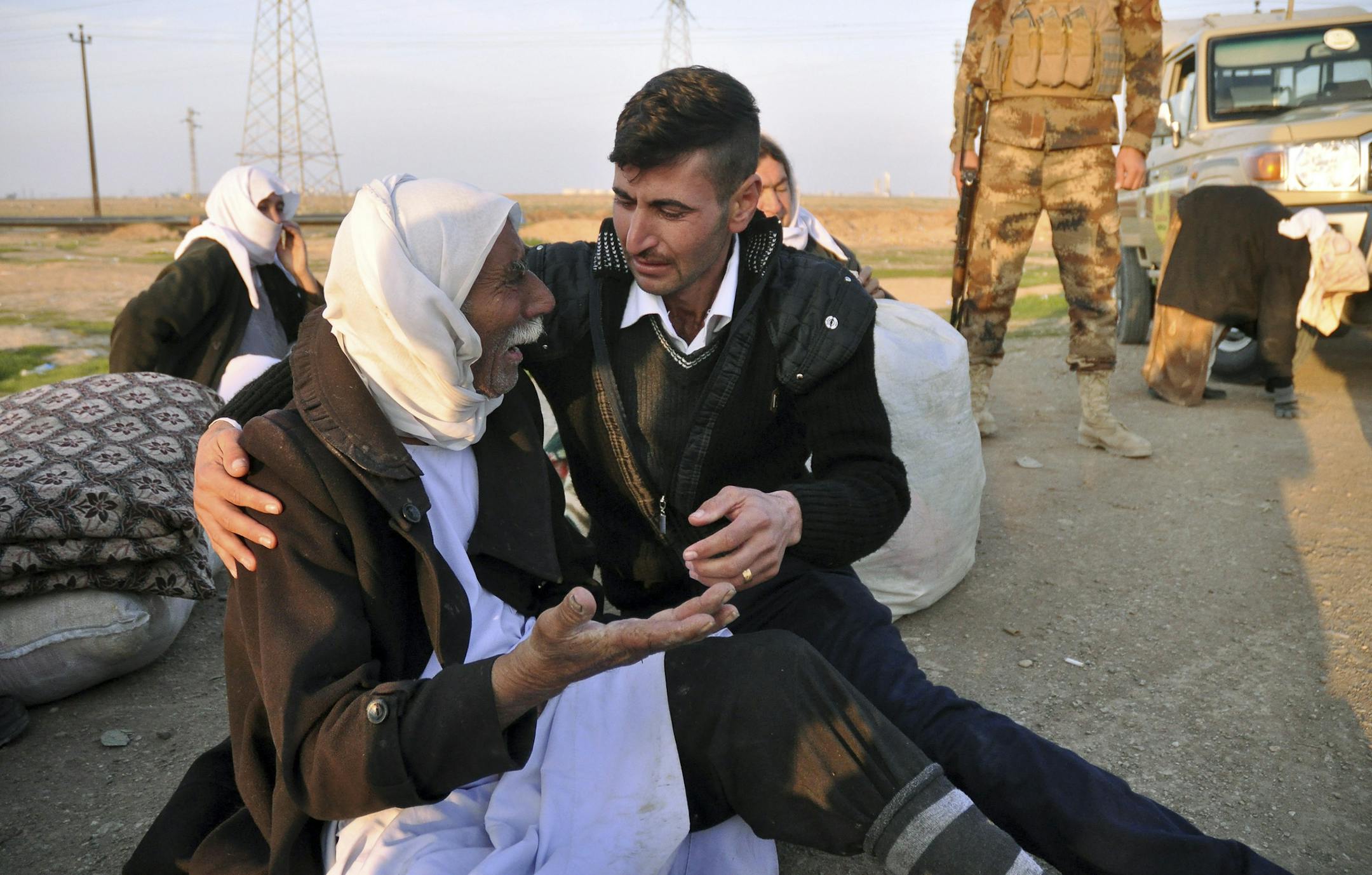 In this photo taken on Saturday, Jan. 17, 2015, an elderly Yazidi, after being released by Islamic militants, arrives in Kirkuk, 180 miles (290 kilometers) north of Baghdad, Iraq. The Islamic State group released about 200 Yazidis held for five months in Iraq, mostly elderly, infirm captives who likely slowed the extremists down, Kurdish military officials said Sunday. Almost all of the freed prisoners are in poor health and bore signs of abuse and neglect. (AP Photo)