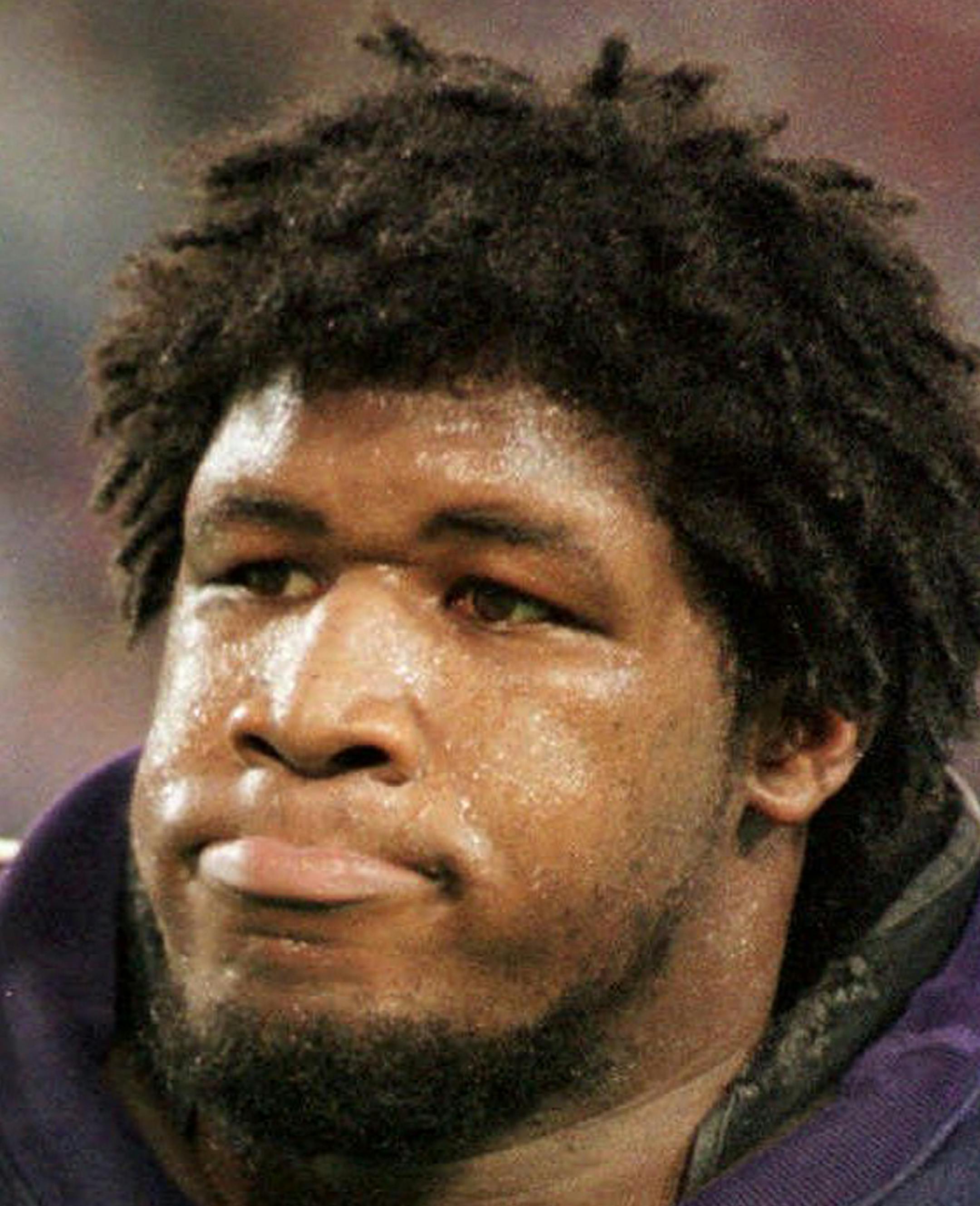 FILE - This Nov. 12, 2000, file photo shows Minnesota Vikings offensive tackle Korey Stringer leaves the field, in Minneapolis. The Vikings have painted a big 77 on their practice field in Mankato to honor Stringer, the offensive tackle who died of heat stroke 10 years ago. (AP Photo/File,Tom Olmscheid, File)