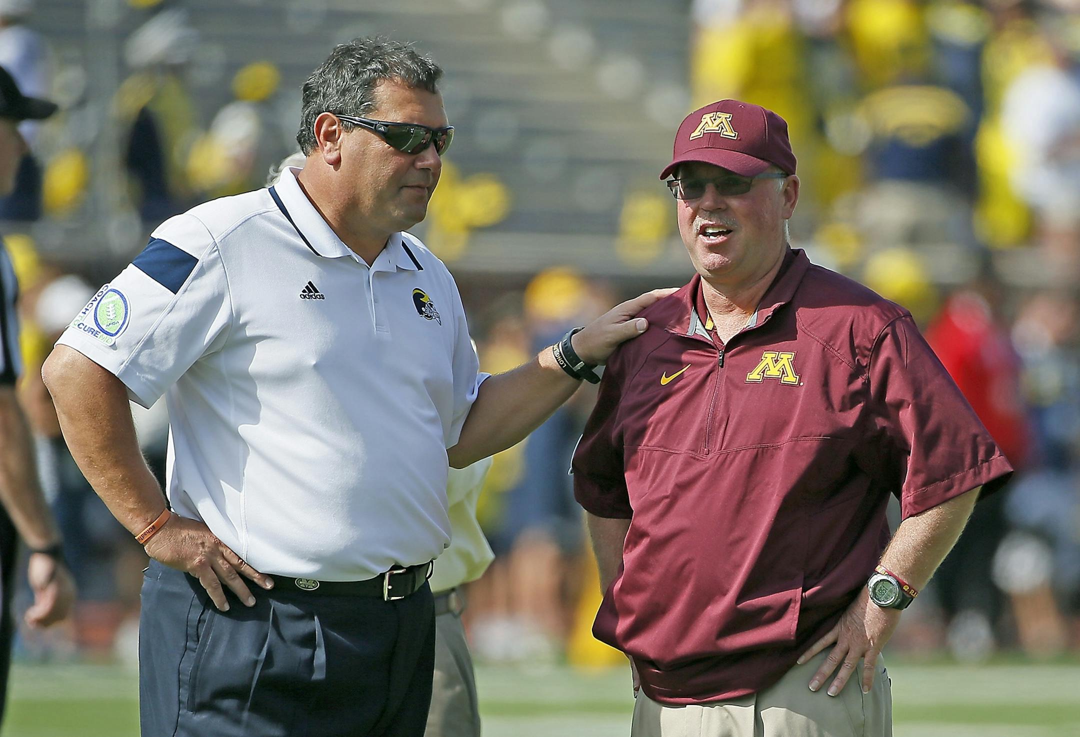 Minnesota Head Coach Jerry Kill and Michigan's head coach Brady Hoke met before the Minnesota Gophers too on Michigan at Michigan Stadium, Saturday, September 27, 2014 in Ann Arbor, MI.