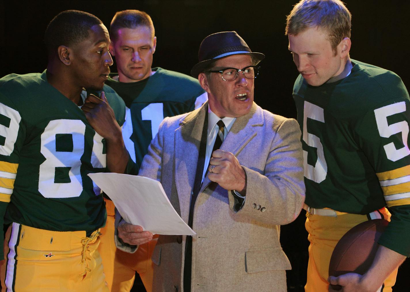 Coach Vince Lombardi (Jim Detmar) shows Dave Robinson (Darius Dotch), Jim Taylor (Eric Knutson), and Paul Hornung (Sam Bardwell) the next play in History Theatre's upcoming production of "Lombardi."