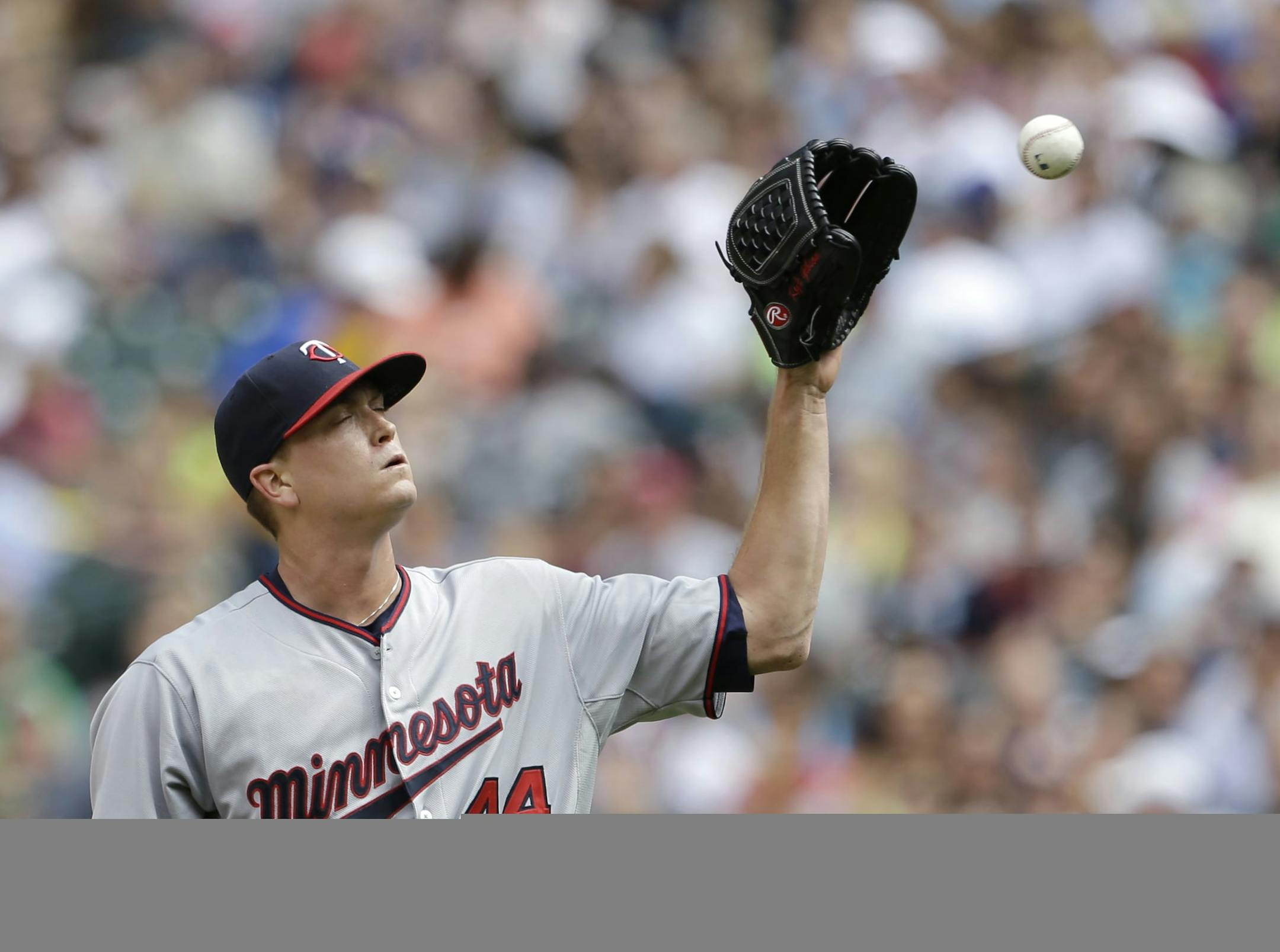 Minnesota Twins starting pitcher Kyle Gibson gets a ball back against the Seattle Mariners in the fourth inning of a baseball game Sunday, July 28, 2013, in Seattle. (AP Photo/Elaine Thompson)