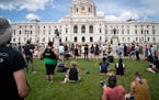 Several hundred people gathered for a rally to commemorate Juneteenth on the grounds in front of the Minnesota State Capitol in St. Paul on Friday.