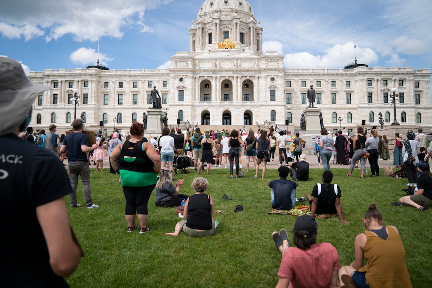 Several hundred people gathered for a rally to commemorate Juneteenth on the grounds in front of the Minnesota State Capitol in St. Paul on Friday.