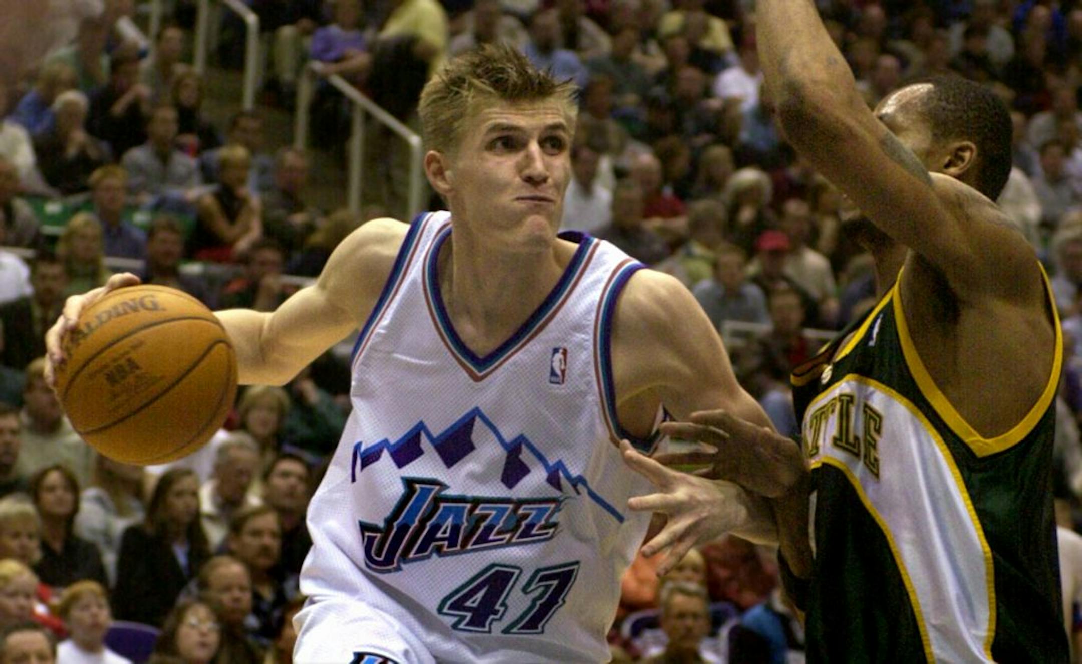 Utah Jazz forward Andrei Kirilenko (41), of Russia, drives past Seattle Supersonics forward Rashard Lewis during the third quarter Wednesday, Mar. 5, 2003, in Salt Lake City. The Jazz beat the Sonics, 94-83.