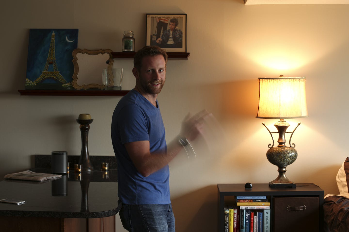 Reemo co-founder and CEO Al Baker demonstrated the simple gesture that when wearing a compatible watch will allow a user to control household appliances such as lights and fans. ] JEFF WHEELER &#xef; jeff.wheeler@startribune.com Reemo co-founder and CEO Al Baker, photographed demonstrating his company's product in his St. Paul apartment Thursday afternoon, September 17, 2015.