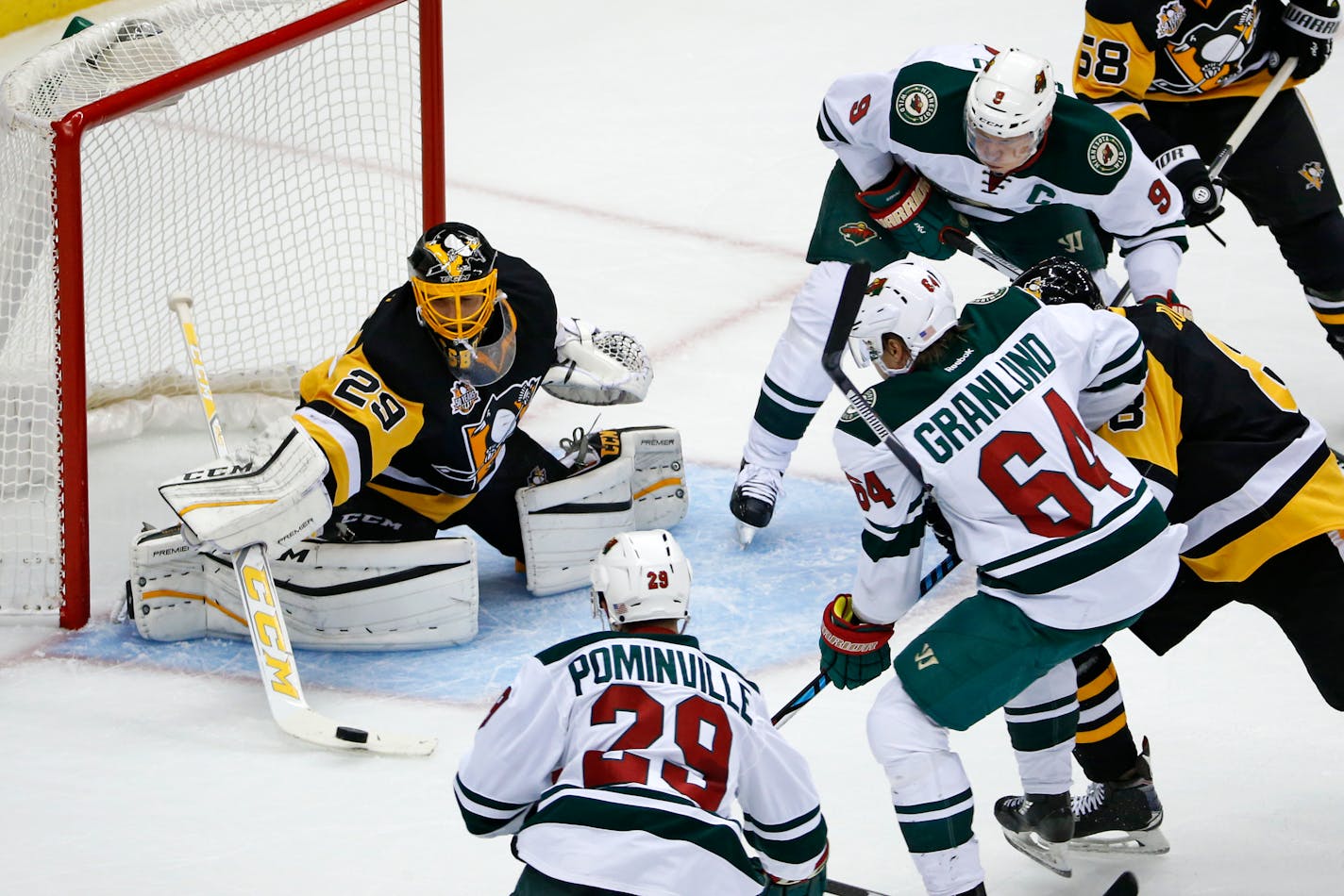 Pittsburgh Penguins goalie Marc-Andre Fleury (29) makes a stick-save during the first period of an NHL hockey game against the Minnesota Wild in Pittsburgh, Thursday, Nov. 10, 2016. (AP Photo/Gene J. Puskar)