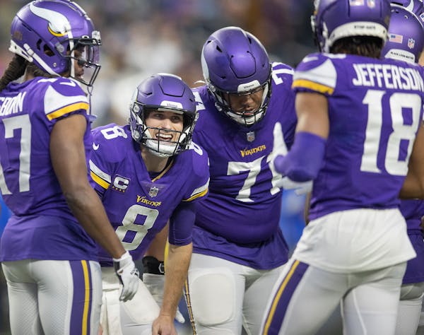 Vikings quarterback Kirk Cousins (8) in the huddle in the third quarter, Sunday, Dec. 26, 2021 in Minneapolis, Minn. The Minnesota Vikings hosted the 