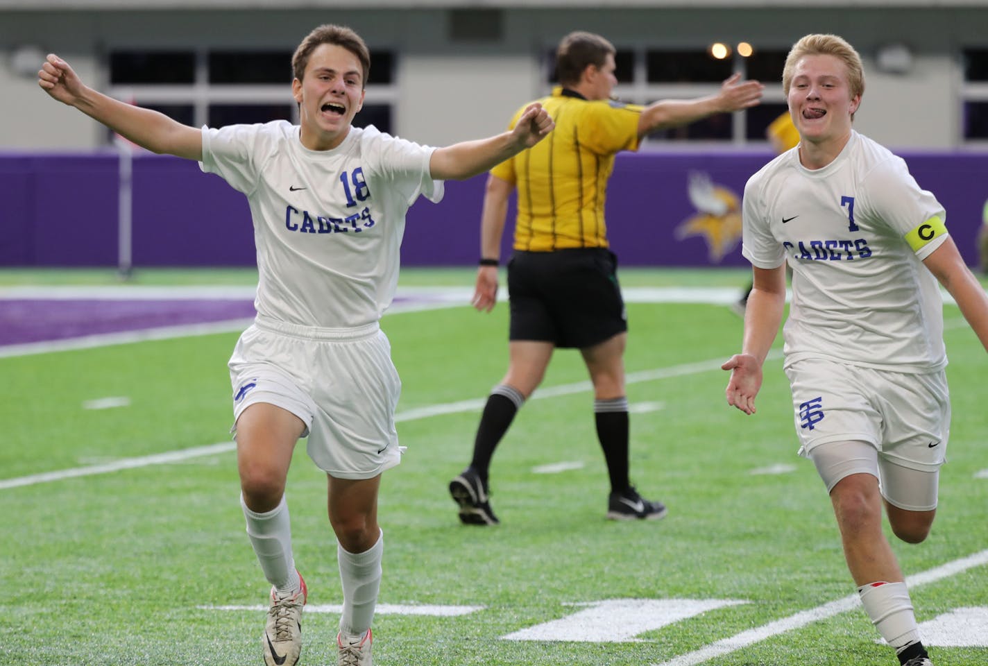 St. Thomas Academy players Chris Martin (16) and Devin Kennedy (7) celebrate Kennedy's winning penalty kick. ] (Leila Navidi/Star Tribune) leila.navidi@startribune.com BACKGROUND INFORMATION: Class 1A boys soccer championships between Northfield and St. Thomas Academy at U.S. Bank Stadium in Minneapolis on Thursday, November 3, 2016. St. Thomas Academy won 1-0 in overtime on a penalty kick that was awarded after a foul.