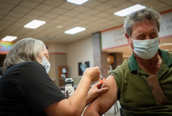 Nurse Susan Hinck gives Richard Thornton a coronavirus vaccine July 10 in Springfield, Mo., where hospital wards have filled with covid-19 patients. M