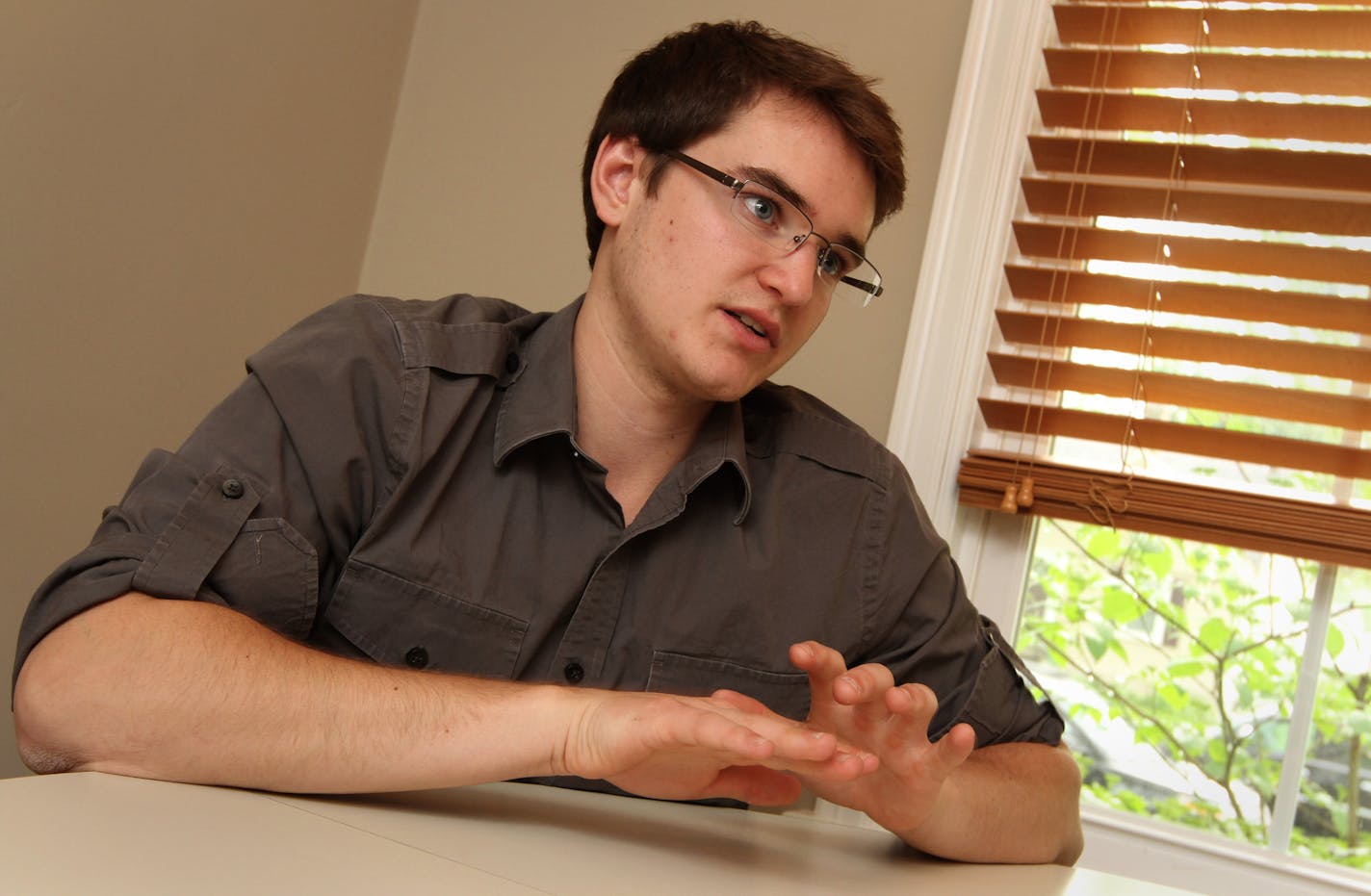 A profile of Michael Golz, a Minnetonka High School student who has excelled academically after losing both of his parents and being raised by his older brother. Photographed at his half-brothers house in St. Louis Park on 5/29/13.] Bruce Bisping/Star Tribune bbisping@startribune.com Michael Golz/source.