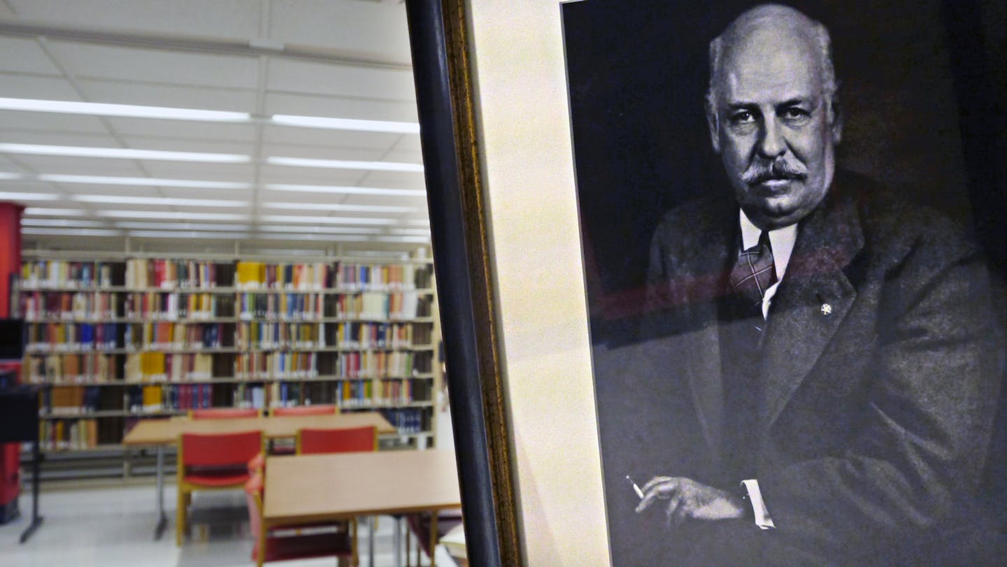 Charles Lesley Ames at the entrance of the Library on the Sub Basement level of the Wilson Library. When author Sujata Massey decided to write a historical novel set in India, she headed to Minnesota, home to the Ames Library of South Asia, one of the best resources on Indian history, and one of the easiest to access that information in the world. ] Tom Wallace &#x2022; twallace@startribune.com ASSIGNMENT #20030348A __ #MAGIC SAXO/SLUG #842494 Library082013 __ EXTRA INFO: When author Sujata Mass