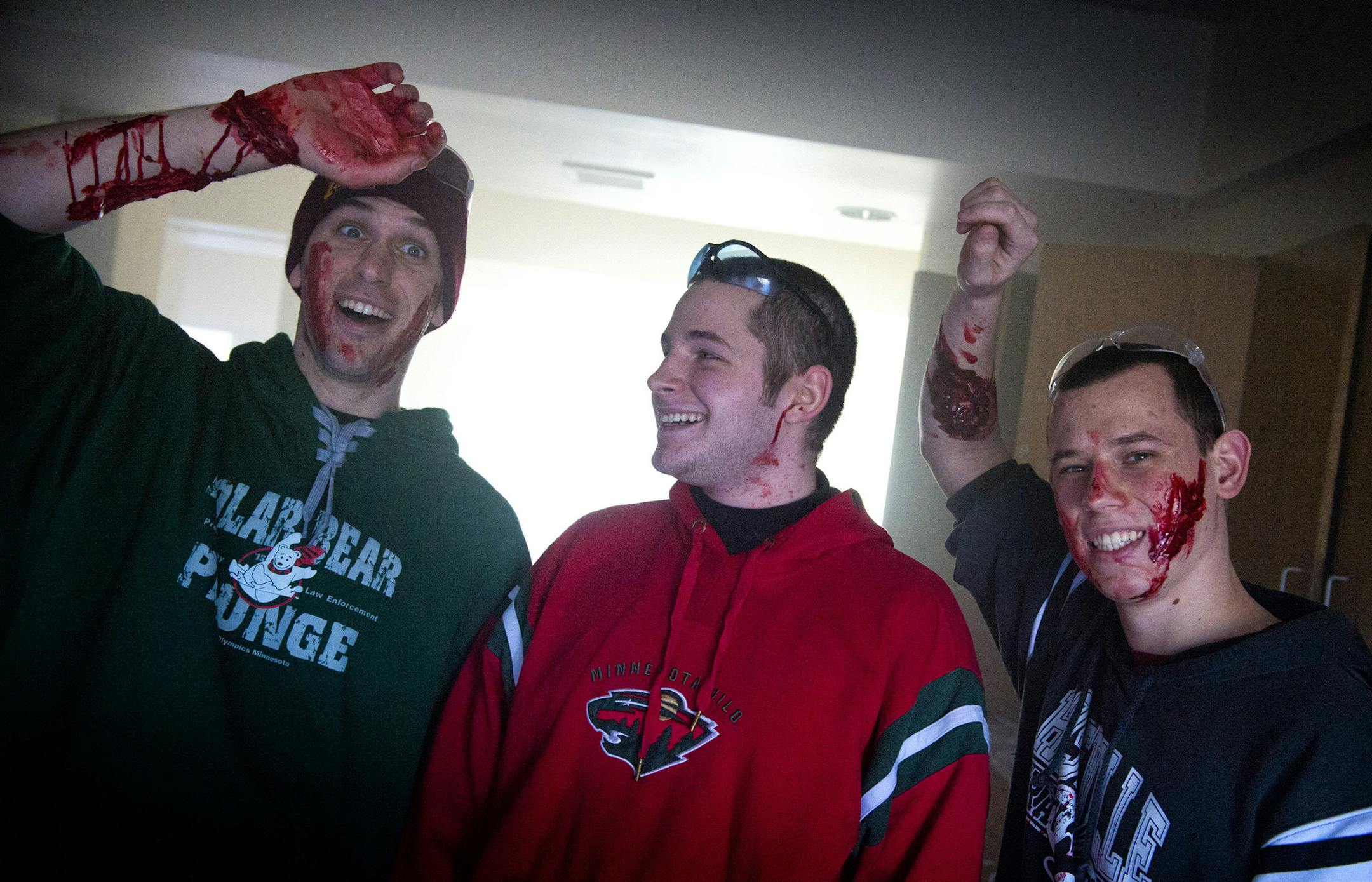 College students, from left, Joshua Riviere, Steven Minion and Dean Spencer, volunteered to be victims in the new St. Paul police and fire training effort in scenarios that mimic shooting events and explosions.