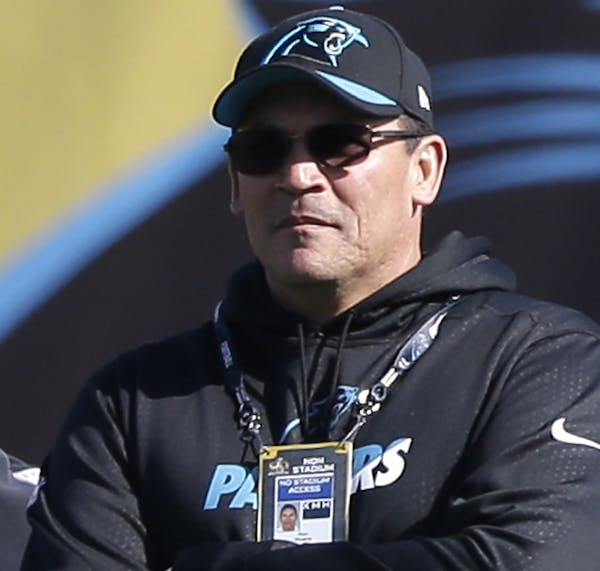 Carolina Panthers head coach Ron Rivera watches his team stretch during practice in preparation for the Super Bowl 50 football game Friday Feb. 5, 201