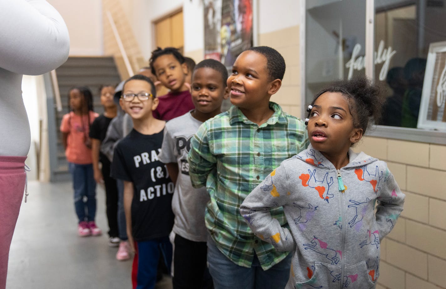 Second grade students in Kandice Childs' class line up after a bathroom break Wednesday, Jan. 10, 2024, at JJ Legacy School in Minneapolis, Minn. The school is being forced to close its doors on Friday due to insurmountable debt. ]