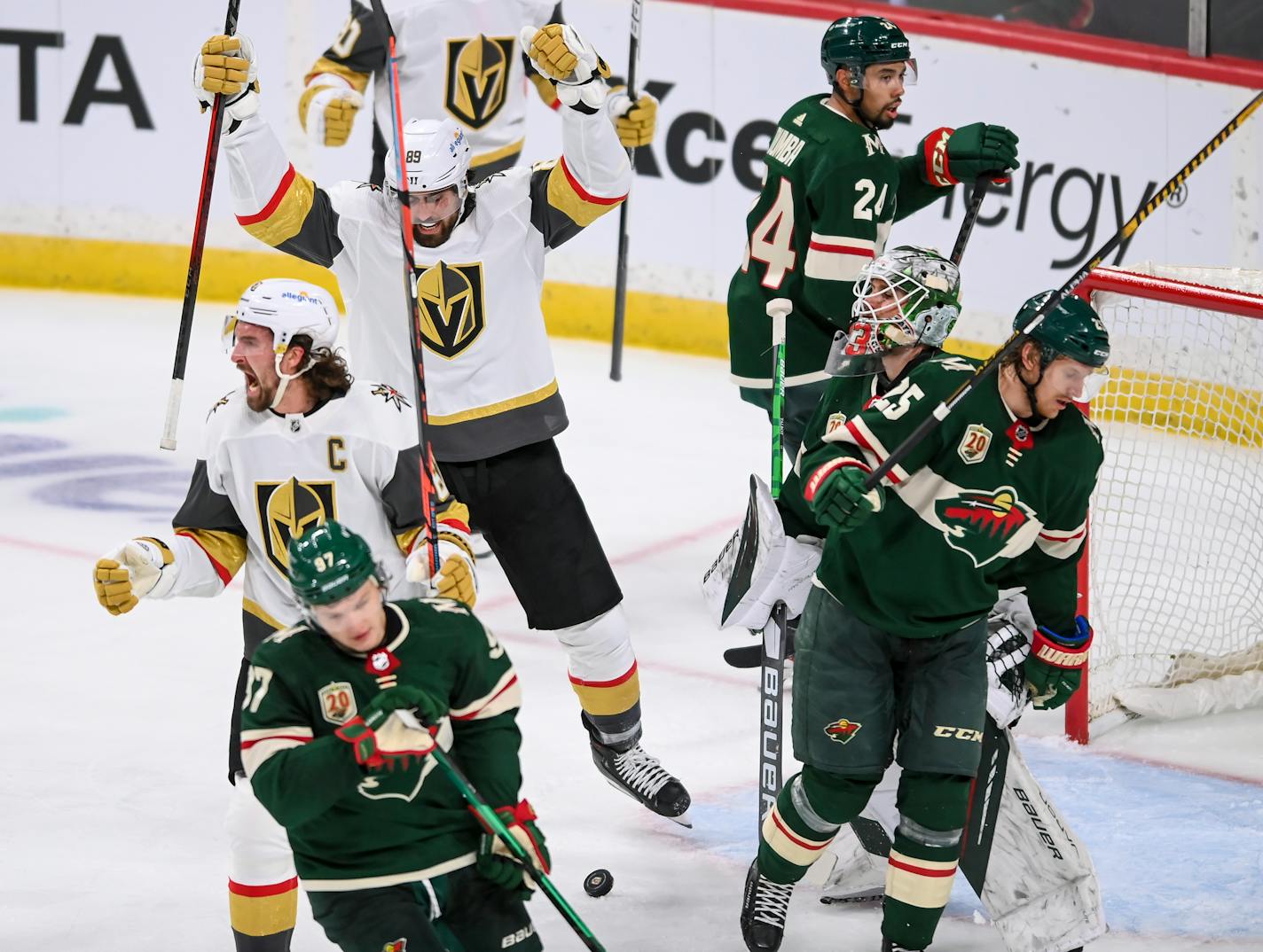 Vegas right wing Mark Stone, left, celebrated after scoring the team's first goal against the Wild in the second period.