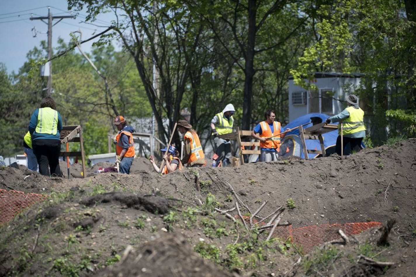 Hamline University alumni and members of the Minnesota Indian Affairs Council worked on excavating the site of Native American burial mounds at a construction site in Minnetonka on Wednesday, May 13, 2015.