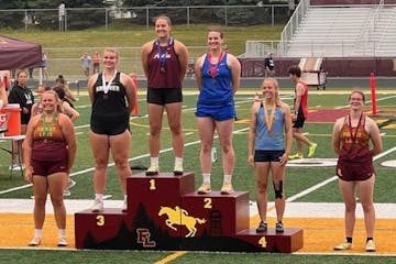 Evelyn Wiltrout grinned from the second spot on the medal stand Friday, the position she needed to claim to qualify for state.