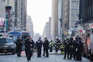 Police and firefighters on Eighth Avenue in New York following an explosion on Monday morning, Dec. 11, 2017. The explosion caused the authorities to 