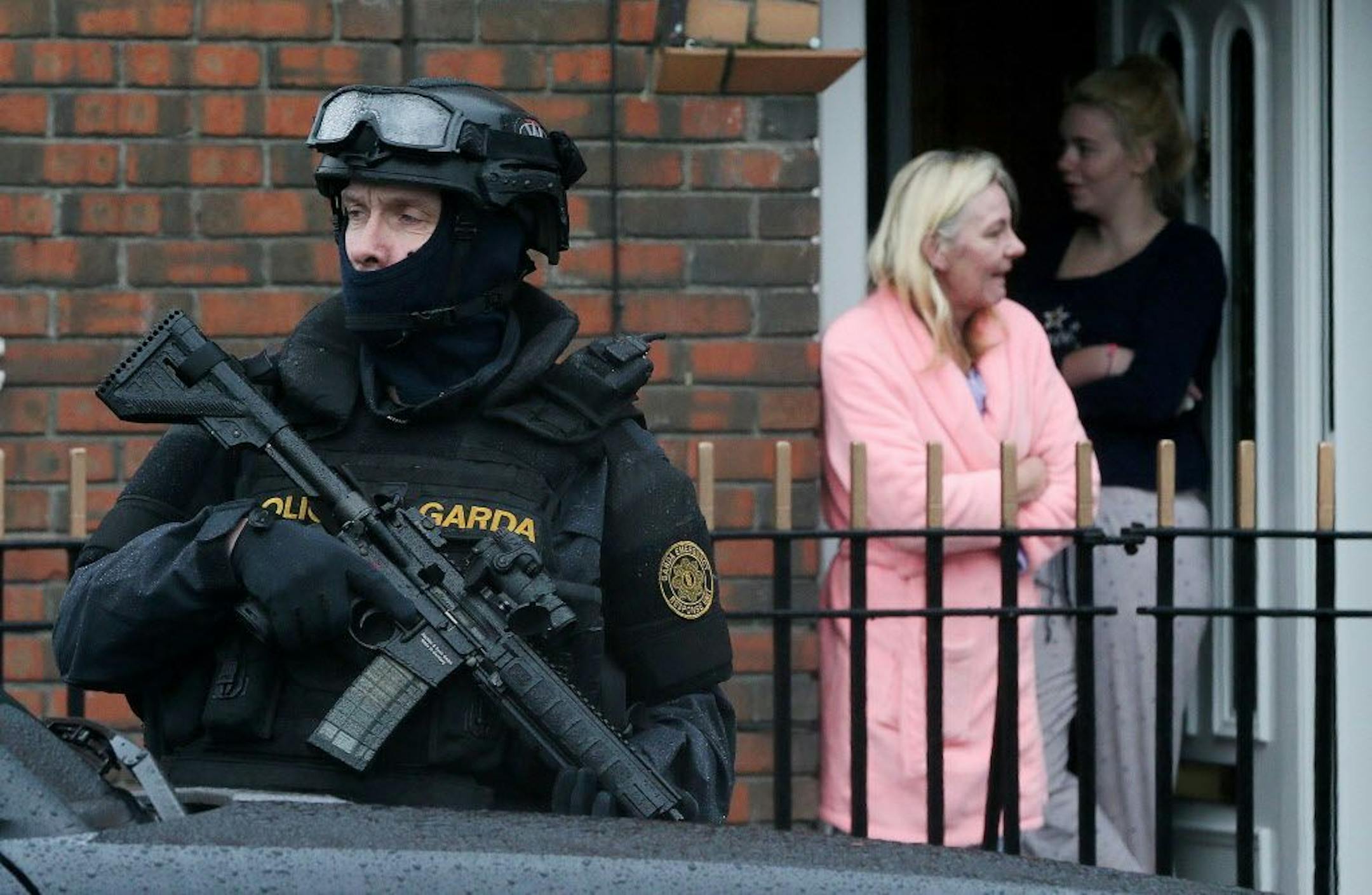 Armed Gardai from the force's Emergency Response Unit on patrol, as gang violence has resulted in two murders in four days, in Dublin, Ireland, Tuesday, Feb. 9, 2016. As Dublin's gangland tensions deepened, Ireland's justice minister urged gang members to seek police protection Tuesday after gunmen shot to death the brother of a Dublin crime kingpin in apparent retaliation for last week's deadly attack on a boxing ceremony. Police have put in roadblocks, increased surveillance on high-profile ta