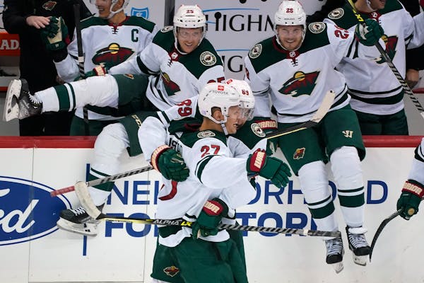 The Wild's Nick Bjugstad celebrates after scoring the game-winning goal in a shootout against the Pittsburgh Penguins