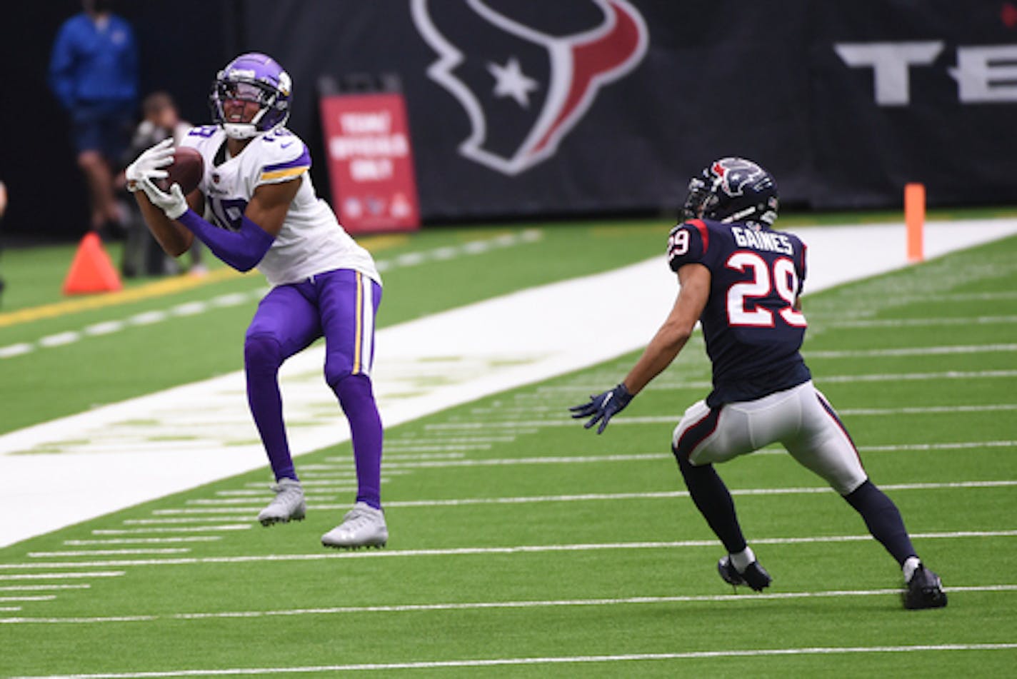 Minnesota Vikings wide receiver Justin Jefferson (18) catches a pass ahead of Houston Texans cornerback Phillip Gaines (29) during the second half of an NFL football game Sunday, Oct. 4, 2020, in Houston. (AP Photo/Eric Christian Smith) ORG XMIT: TXEG1