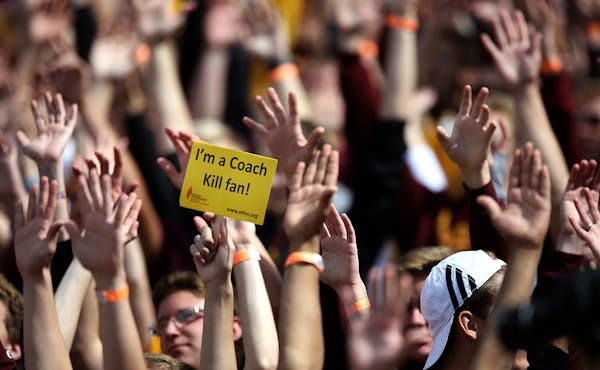A fan in the student section held a sign in support of head coach Jerry Kill in the second half.